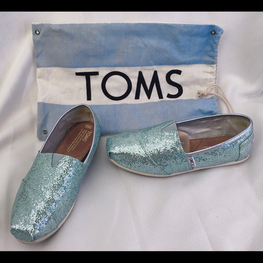Tom’s new with bag blue glitter slip ons Size 8.5
